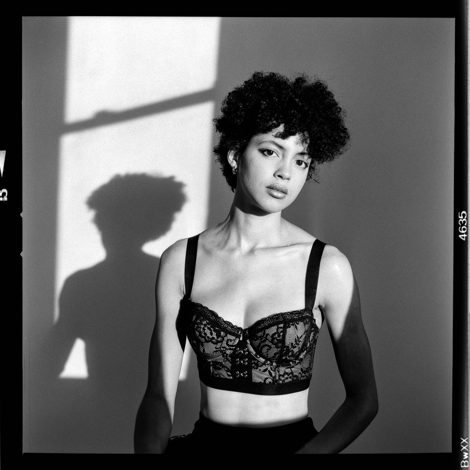Medium-format film portrait in black lace bustier