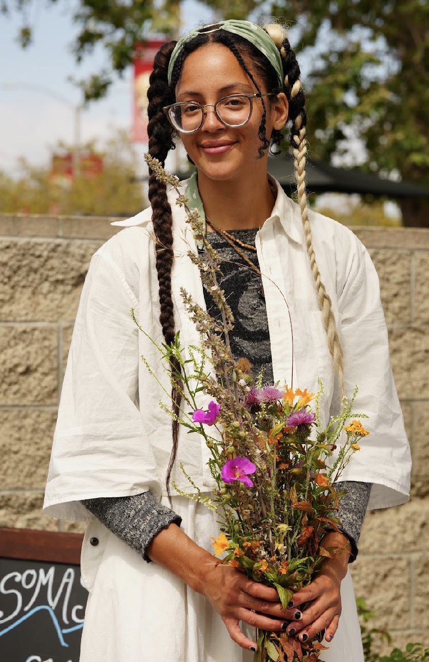 Atara Horrigan holding a wild-foraged bouquet